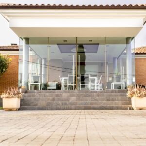 Why Buying Real Estate Instead of REITs Is Boneheaded close up of house entry with porch and garden low a27txmn